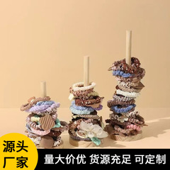創意的な木のひもの収納棚の髪のひもの頭の花の棚のブレスレットの手の串は屋台を並べて道具の棚を展示します。