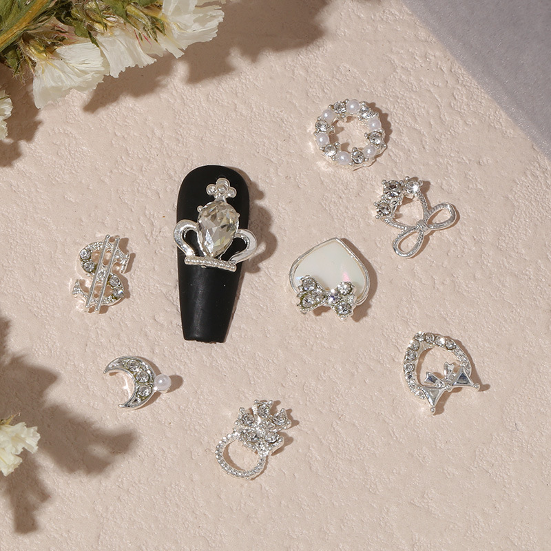 Nuevo arco de uñas amor aleación decoración de uñas flor de la luna mariposa clavo taladro fábrica joyería al por mayor