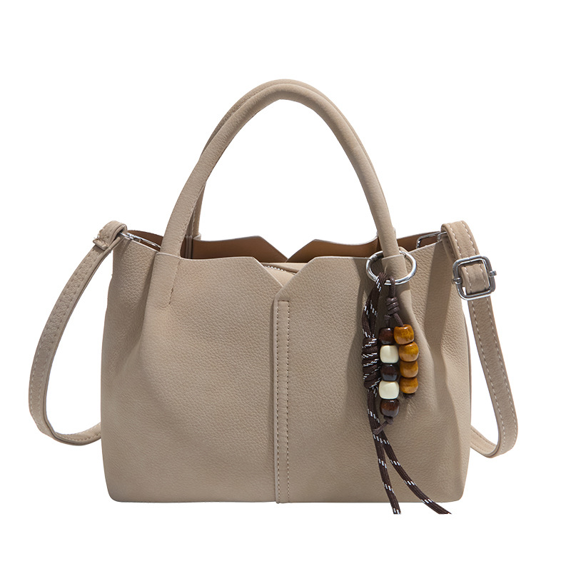 Bolso de mano de alta sensación de moda bolso de balde de mujer 2025 invierno retro simple bolso de hombro temperamento mochila de viaje