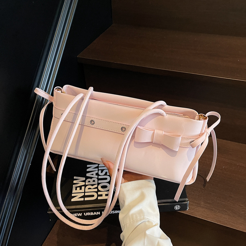 Bolso de axila popular de este año 2025 verano nuevo bolso femenino bolso de textura esmerilada bolso de hombro de color en contraste con lazo