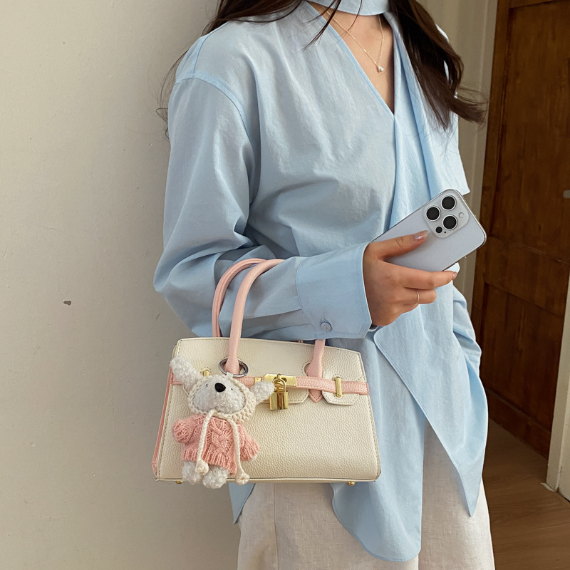 Coreano simple bolso de mano mujer 2026 primavera nueva bolsa de viaje diario texturizada bolso de mochila