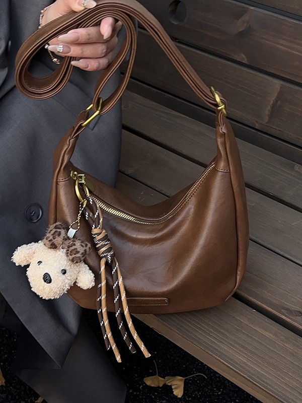 Bolsa de moda coreana bolsas de bollo de moda mujeres 2025 nuevo estilo simple ocio textura alta versátil mochila de hombro