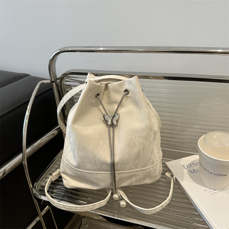 Butterfly texture bolso para mujeres 2024 verano nuevo hombro brazo bolso de cubo bolso de diseño sensación de mochila de viaje