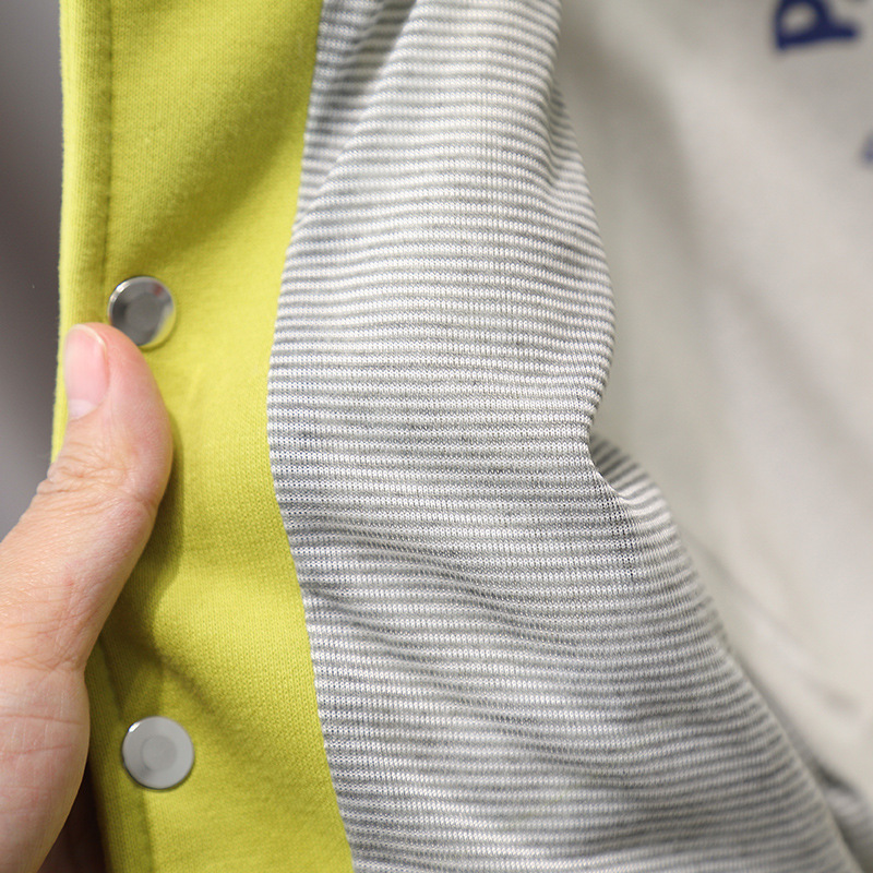 7660 chaqueta de primavera para niños 2025 nuevo chico guapo primavera chaqueta coreana primavera y otoño uniforme de béisbol de dibujos animados