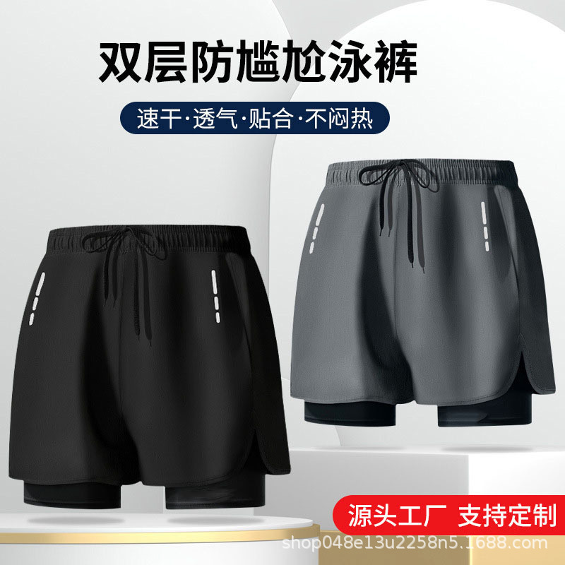 Pantalones deportivos de doble capa de explosión transfronterizos sueltos grandes ángulos planos anti-avergonzamiento correr pantalones de baño de fitness personalizados