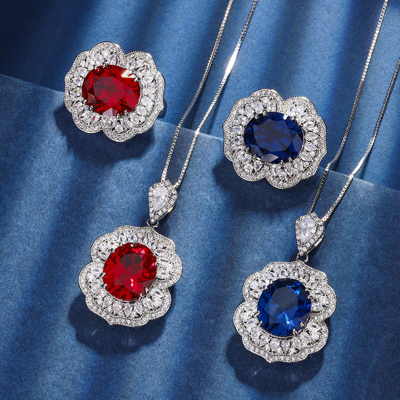 Otoño e invierno Nueva Zhuang Sheng joyería de cobre inferior chapado en oro simulación rojo corindón zafiro azul cristal puntiagudo traje avanzado femenino 12*14