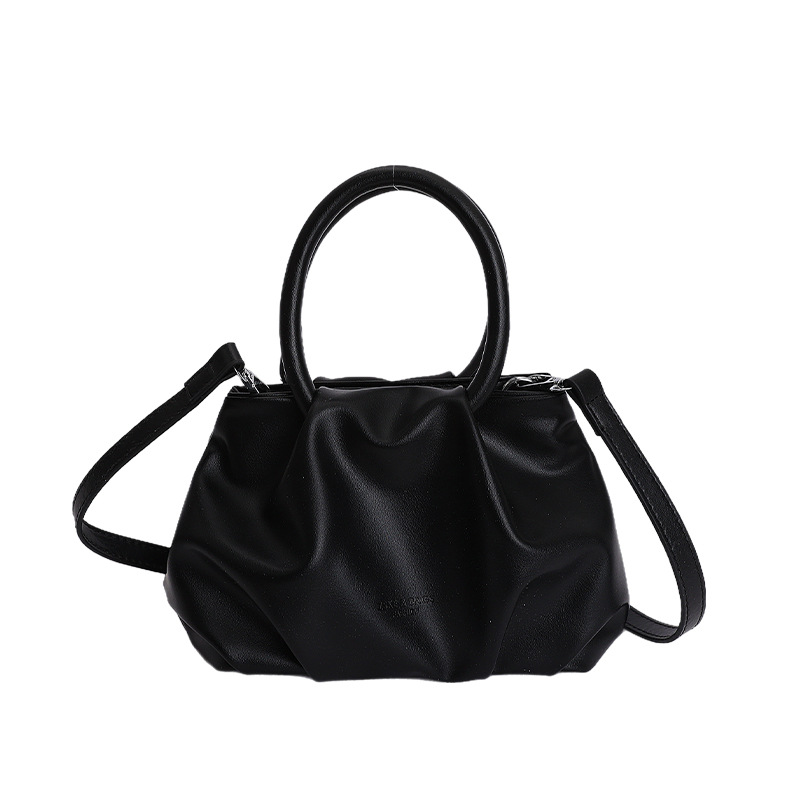 Alta sensación de mano pliegueada nube bolso de cubo para mujeres 2026 nuevo nicho de lujo ligero de moda perla bolsa de mochila