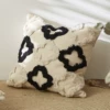 Tufted black and white four leaf clover