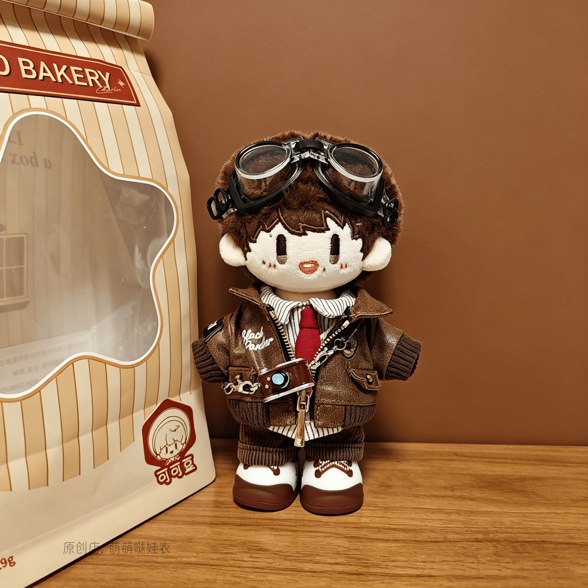 Leather jacket + British shirt + brown pants + camera + goggles + baby shoes