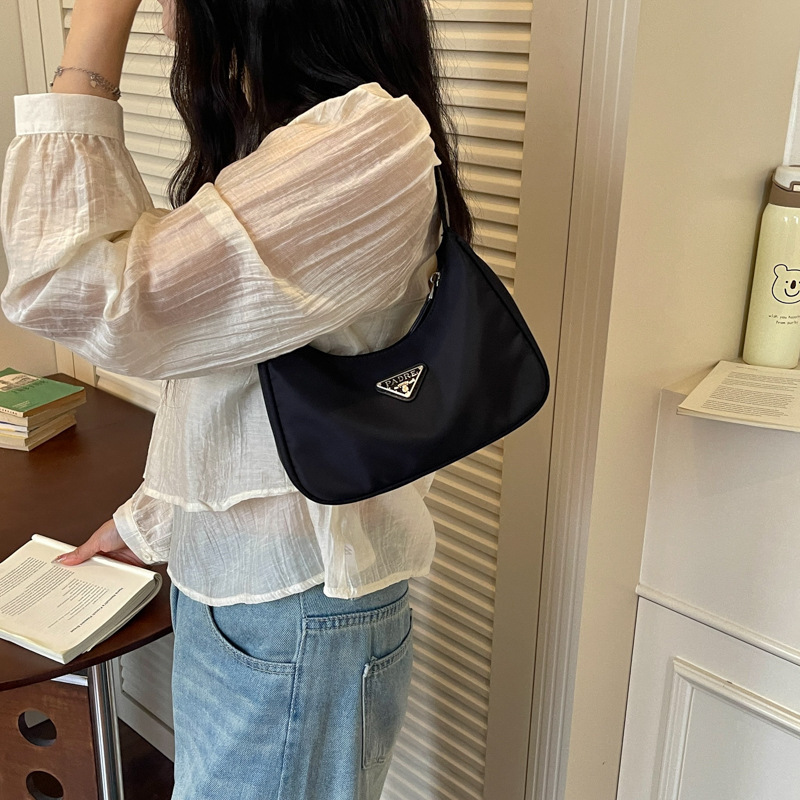 Wholesale simple retro triangle logo nylon underarm bag 2026 new crescent small bag commuter waterproof shoulder bag