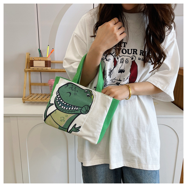 Cute cartoon printed small bag, 2024 summer new style hand-held piggy girl handbag, student storage canvas bag undefined