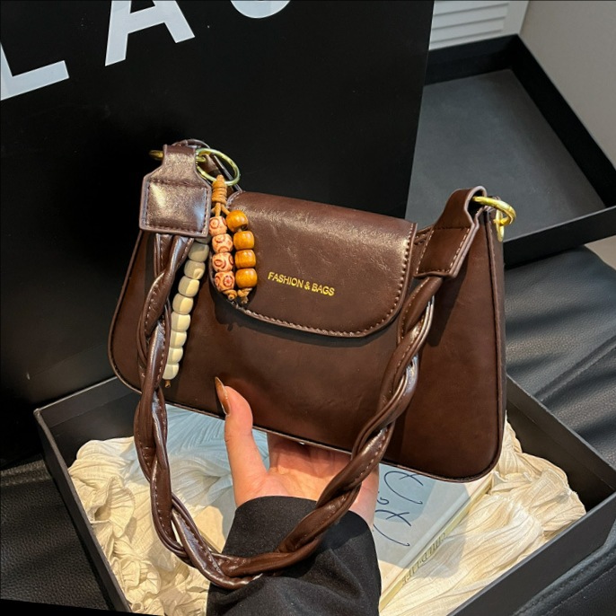 Bolsas de mujer transfronterizas retro de cuero suave de hombro brazo bolsas de invierno 2025 nuevo estilo de alta calidad de la mochila de viaje al trabajo