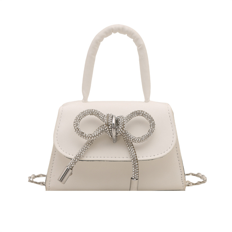 Bowknot Fashion versión coreana de estilo occidental pequeño bolso cuadrado bolso femenino 2025 verano nuevo bolso de cadena de viaje salvaje mujer
