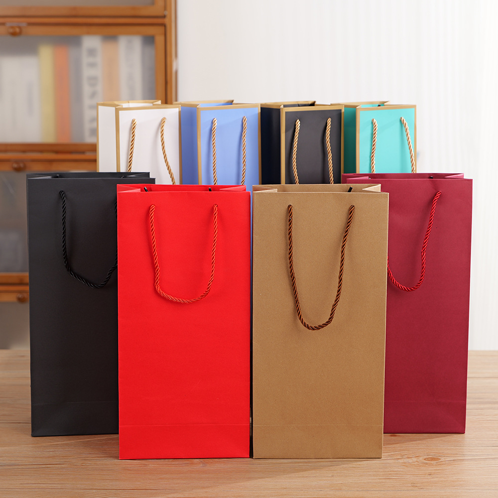 現物の高級ワインの手提げ袋は、シングルワインのギフト包装袋の紙袋を厚くしてロゴを印刷することができる