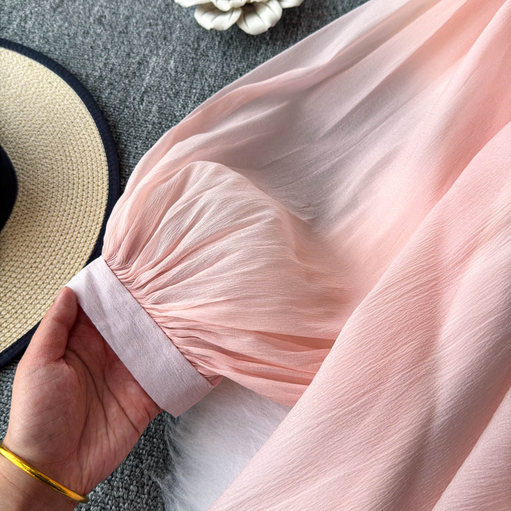 Camicetta elegante da donna con maniche a puff e dettagli floreali_voghion.com