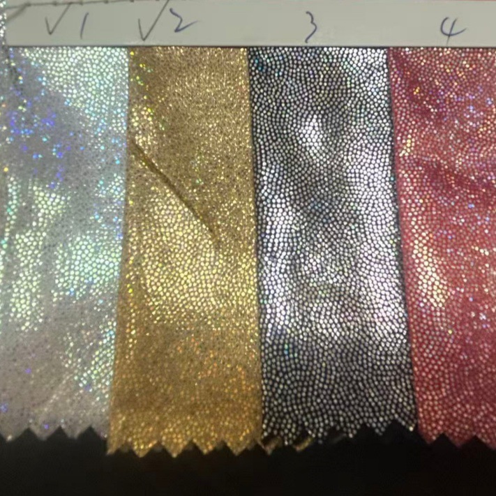 新款七彩镭射幻彩烫金布舞台服装面料桌布玩具布圣诞面料