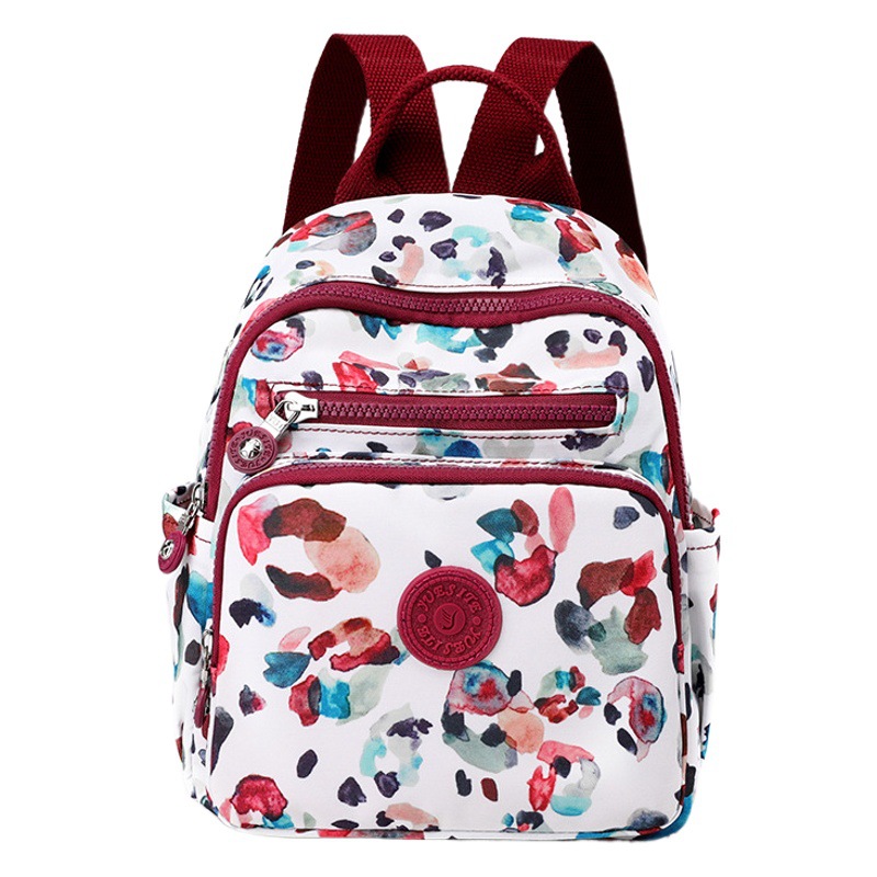 Nuevo estilo coreano mochila de mujer de moda de mediana edad y anciano madre viaje pequeña mochila de nylon mochila casual al por mayor