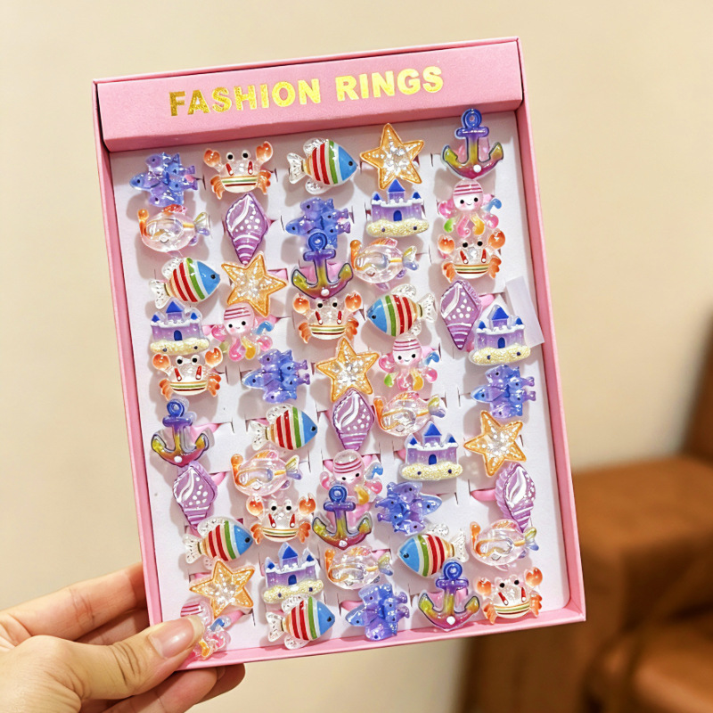 Anillo de flores de dibujos animados para niños transfronterizos 50 anillos de plástico esmerilado abierto en caja regalo de cumpleaños jardín de infantes