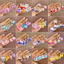 创意精致入油钥匙扣挂件亚克力流沙瓶书包小挂件批发节庆礼品批发