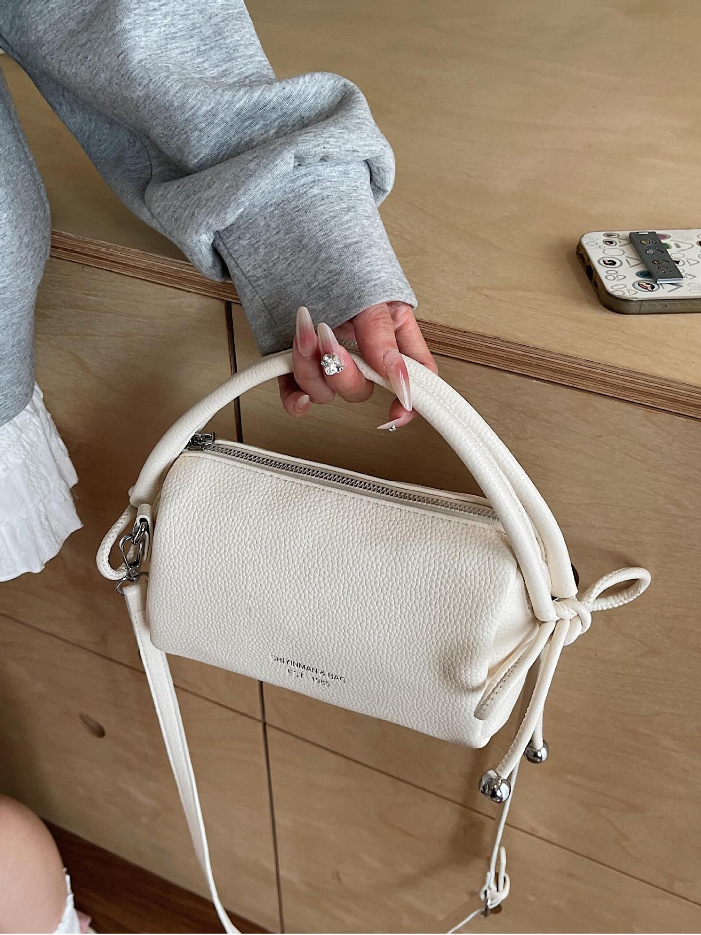 Bolso de mano simple coreano para mujeres 2025, nuevo tipo de bolso de viaje, bolso casual, ligero y de alta calidad.