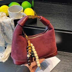 秋冬2025新款复古超火小包包女单肩斜挎包小众设计手提通勤饺子包