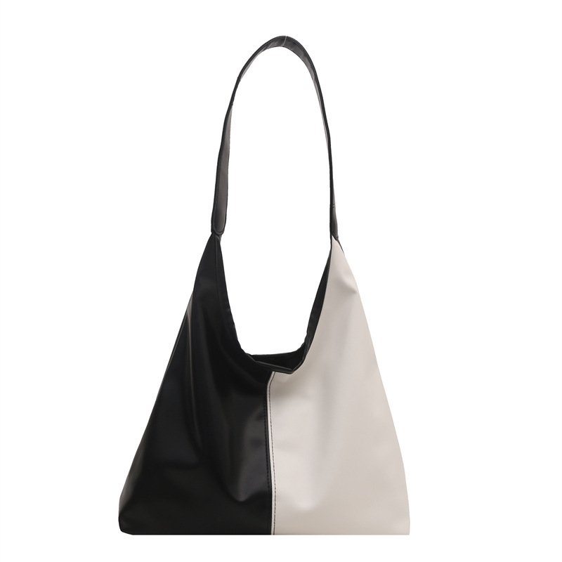 Bolsa de mujer de gran capacidad, textura de 2024, nueva moda simple, bolsa de hombro universal, bolsa de brazo de viaje de color.