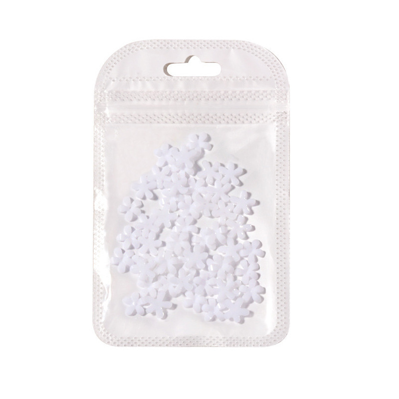 Popular manicura popular en línea pequeña flor blanca tamaño blanco mezclado flor de cinco pétalos con pequeña bola de acero tridimensional decoración de uñas de resina