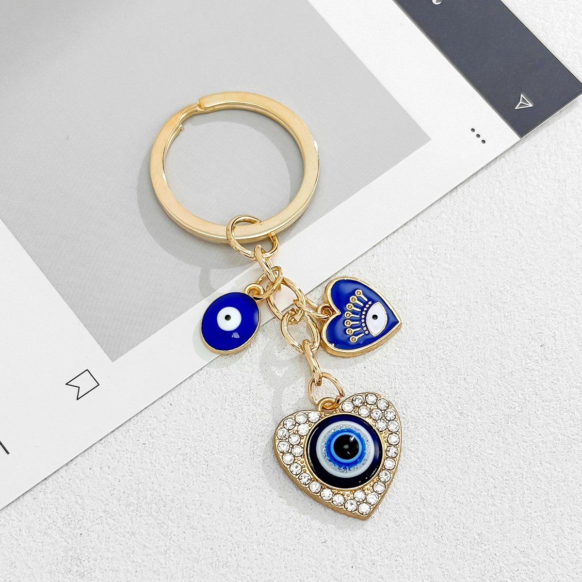 Cross-Border Hot Sale New Heart-Shaped Palm Water Drop Evil Eye Pendant Accessories Keychain Key Ring Manufacturer_voghion.com