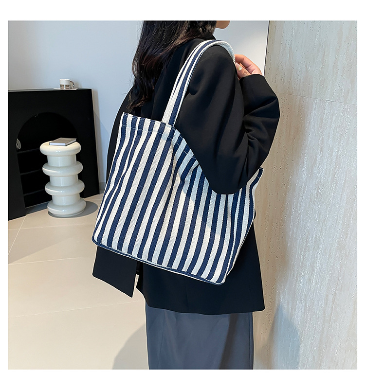 2024 Autumn/Winter new versatile and fashionable striped handbag shopping bag, two-tone large-capacity trendy single-shoulder bag undefined