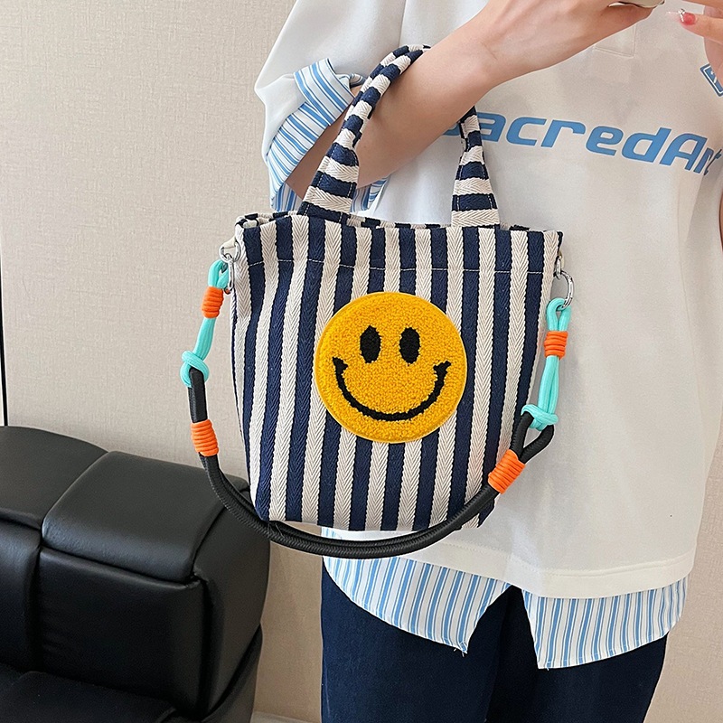 Bolso de moda coreana 2025 nuevo bolso estilo estilo universitario bolso de hombro a rayas lindo sonriente bolso de mensajero mujer