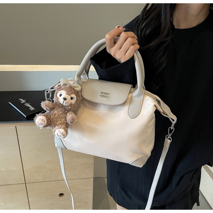 Nylon color contrastante empalme bolso de bolsillo portátil mujer 2024 nuevo estilo transfronterizo de alta calidad exquisita mochila de hombro