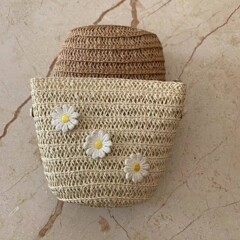 夏の旅行のファッションの女の子の子供のリュックサックのショルダーバッグは0財布の草を飾って手芸を編んで外国貿易を卸売りします。