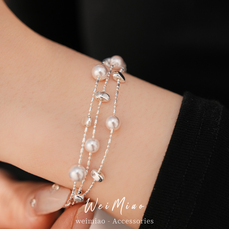 Pulseras de perlas redondas multicapa ligeras de lujo nicho pulseras de alta calidad temperamento de moda universal joyas al por mayor para mujeres image 5