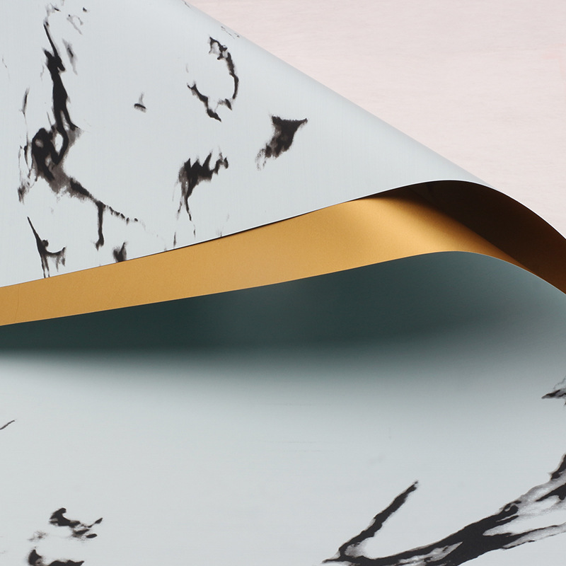 Huaxi comercio exterior transfronterizo mayorista oro lujo papel impermeable mármol oro papel de flor florista papel de embalaje
