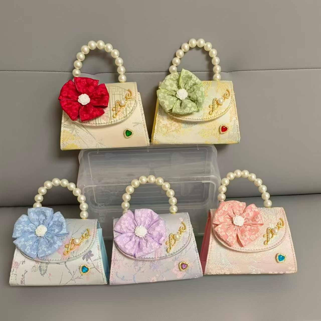 Bolsa infantil nueva niñas bolso de hombro accesorios de ropa china bolso cuadrado princesa bolso de perlas bolso arco bolso de mochila