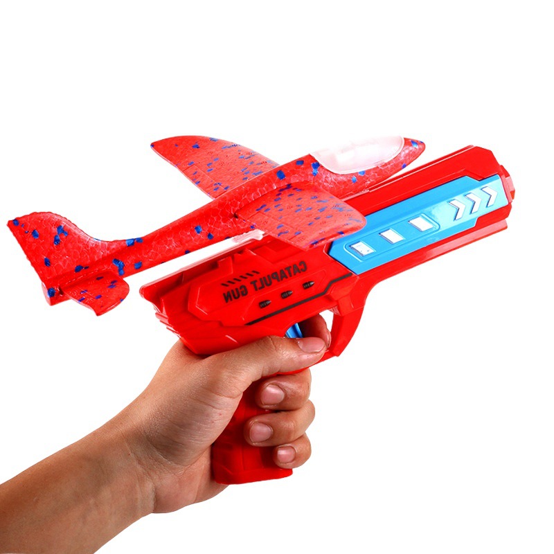 Popular Catapulta de espuma Aeronave Gun Niños Al Aire Libre deslizándose flash tiro mano aviones puesto caja color juguete al por mayor