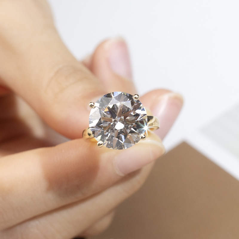 Lab-grown diamonds, synthetic D-color round brilliant cut diamonds from Henan, set in K-gold rings, pendants, and earrings, IGI certificate.