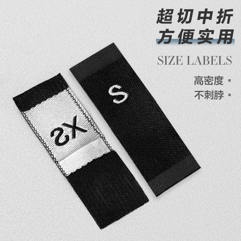 En stock Etiqueta de tamaño de alta densidad en blanco y negro Etiqueta de tamaño universal Etiqueta de código de letra inglesa Pantalones Etiqueta de código de cuello de camiseta