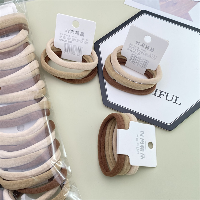 Estilo coreano accesorios para el cabello etiqueta simple leche té pelo cuerda 3 tarjetas grandes sin costura diadema 2 yuanes tienda tocado