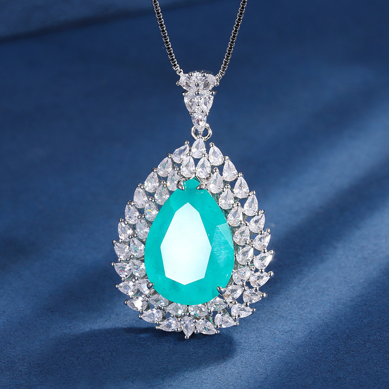 Zhuang Sheng joyería cobre inferior oro plateado traje europeo y americano simulación color tesoro gota de agua diamante anillo colgante 13*18