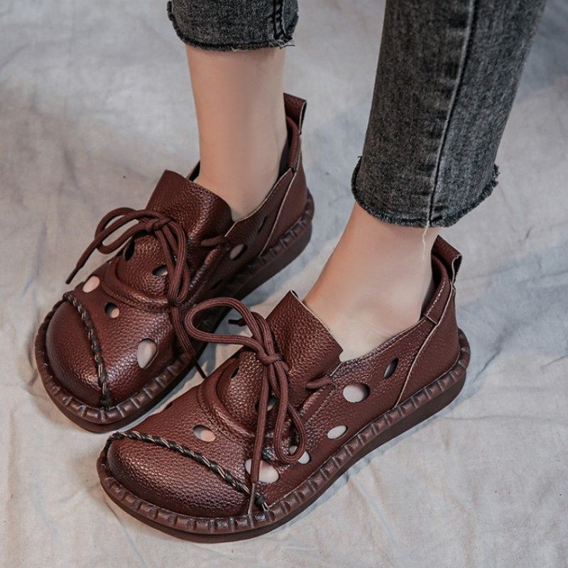 2026 nuevo tamaño de lazos delanteros de alta calidad retro sandálias romanas con base plana agujero agujero zapatos sandalias mujeres
