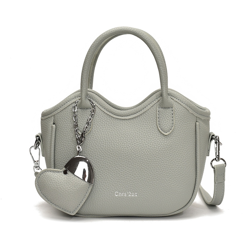 Bolsos pequeños de moda súper calientes de nicho para mujer 2025 nueva tendencia bolsa de cubo de aire extranjero estilo caliente de verano bolso de hombro de mano