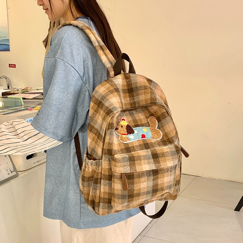 Mochila versión coreana de la versión coreana de la cuadrícula cuadrada de gran capacidad, mochilas escolares para estudiantes de secundaria y secundaria son simples y completas con paquetes de viaje de corta distancia.
