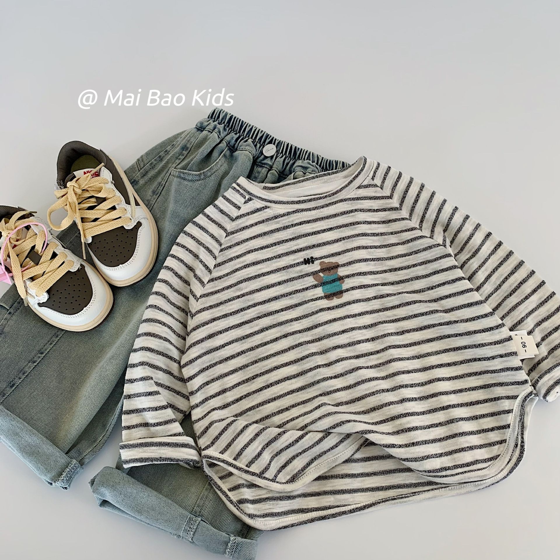 Camiseta infantil Mai Bao2025 otoño niñas y niños adorables camisetas a rayas de oso casuales versátiles nuevas camisetas de manga larga