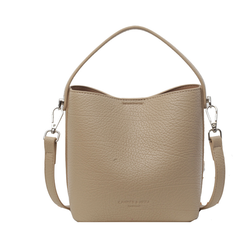 Bolsa de mano con estampado de litchi de alta calidad, dama, 2024 primavera y verano, nueva bolsa de hombro universal, diseño simple, bolsa de cubo