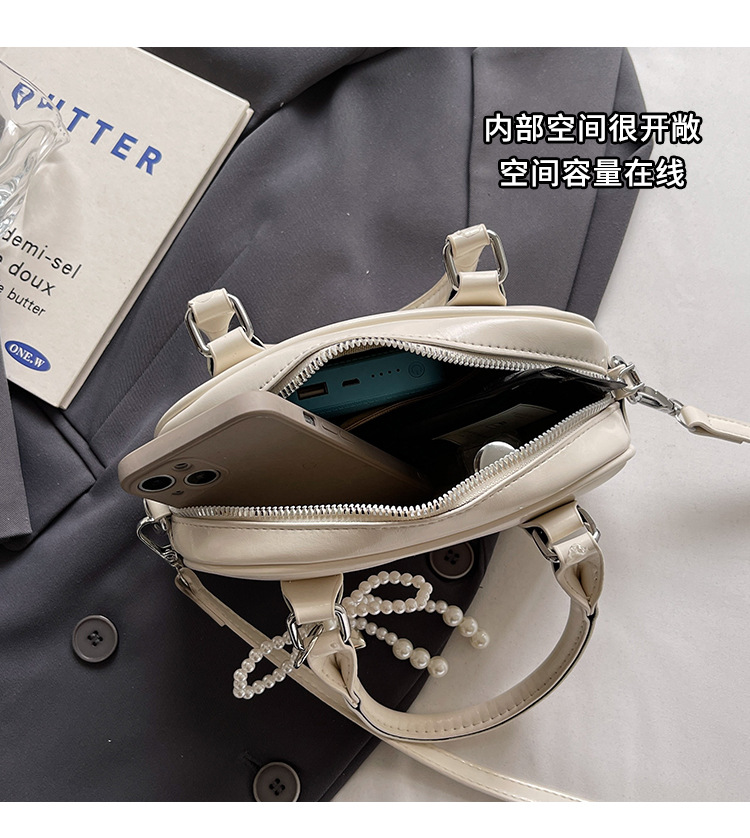A fashionable Korean-style small square bag for women in the summer of 2025, featuring a simple and retro single-shoulder, crossbody and hand-held pillow bag undefined