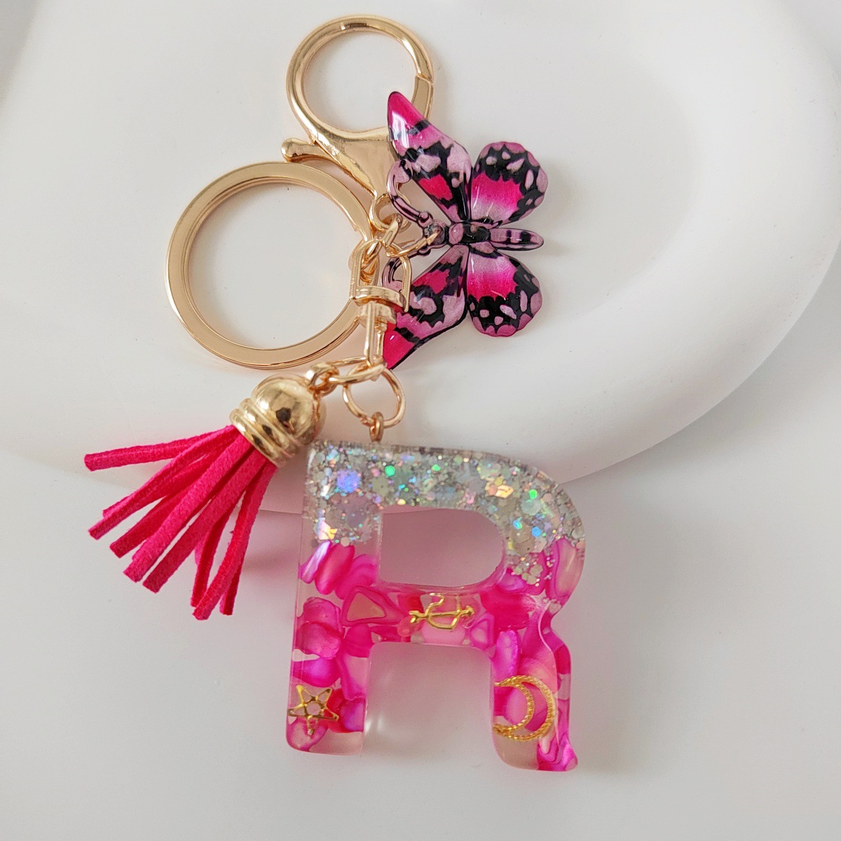 Inventario transfronterizo nueva resina bicolor mariposa borda llavero colgante estrella luna accesorios de joyas