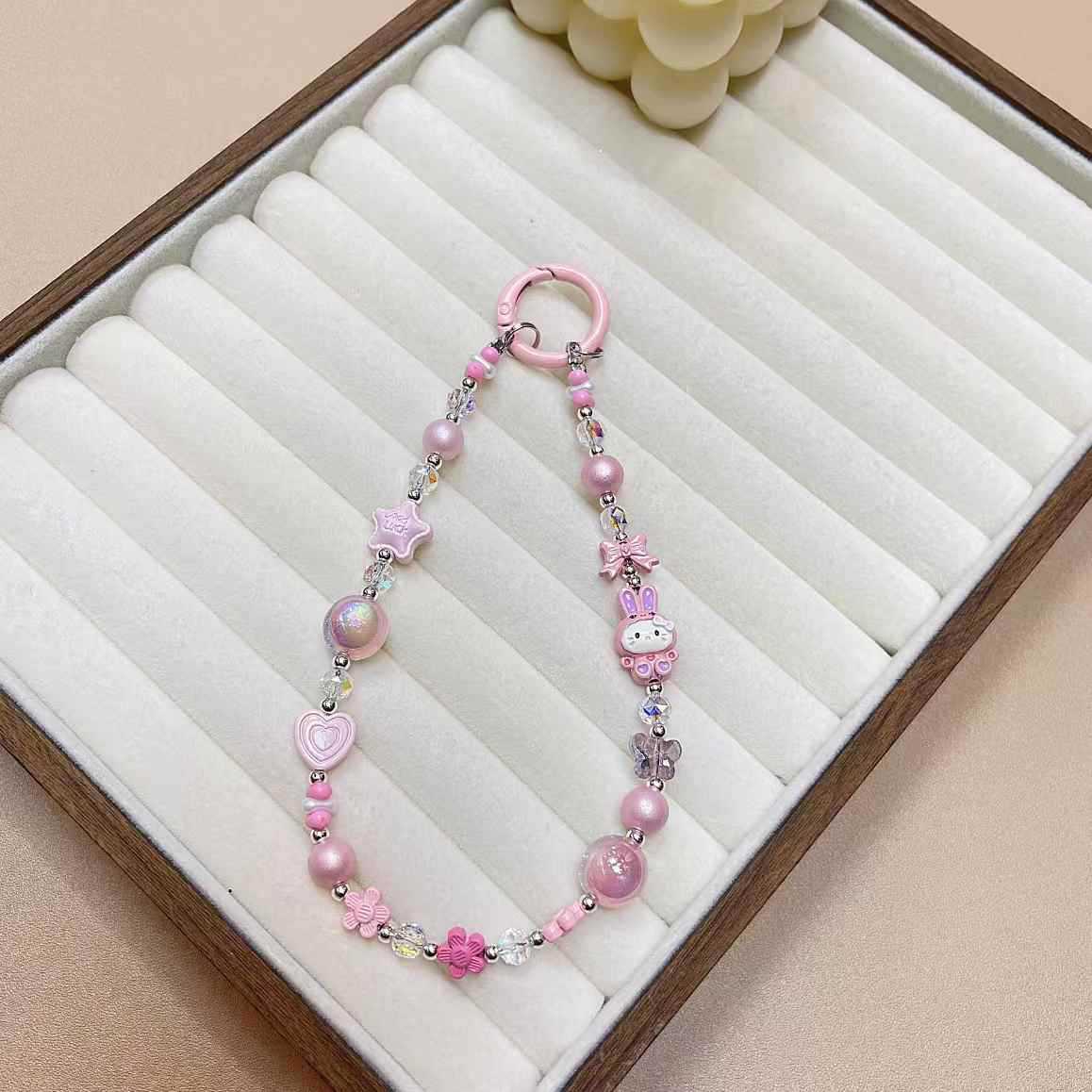 Creativo de dibujos animados KT conejo aleación cadena teléfono móvil cordón muñeca nuevo DIY hecho a mano cuentas estrella de cristal colgante de equipaje