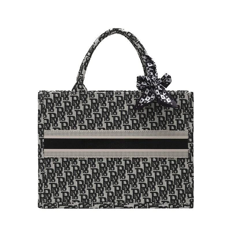 Bolsos bordados de alta calidad para mujeres 2026 nuevas letras de tela transfronterizas retro bolsas de mano de transporte de gran capacidad