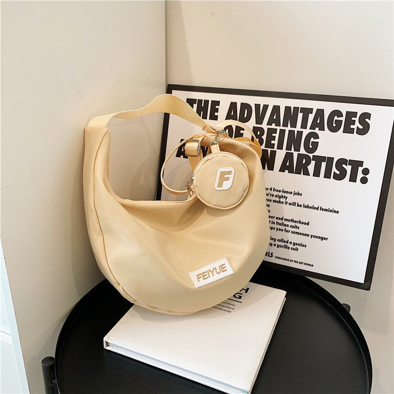 Bolsa de bolinillos de gran capacidad 2025, primavera nueva bolsa de viaje, bolsas de hombro inclinadas para estudiantes universitarios.